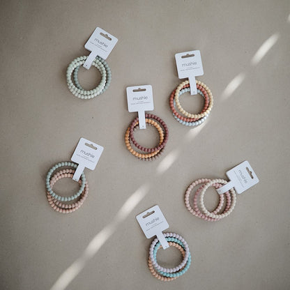 Pack de 3 Pulseras Mordedores de Silicona - Pearl -  Lilac - Cyan - Soft Peach | Mushie