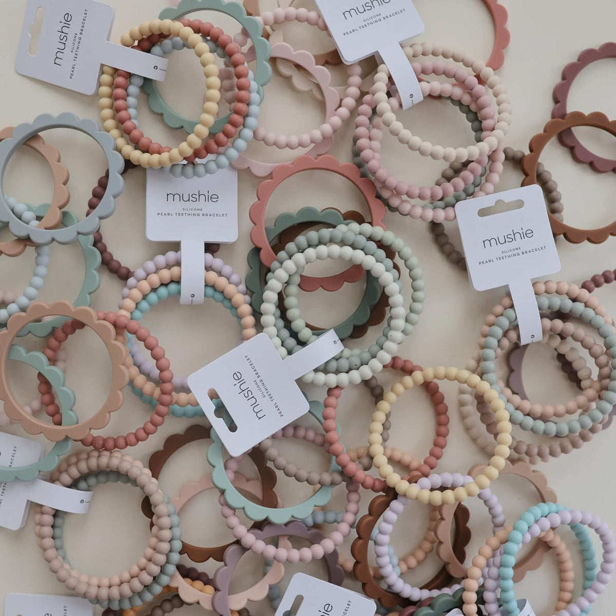 Pack de 3 Pulseras Mordedores de Silicona - Pearl -  Lilac - Cyan - Soft Peach | Mushie